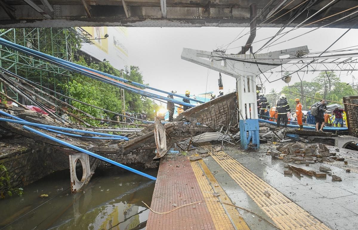 A part of the Gokhale foot overbridge that collapsed on the Western Railway tracks, at Andheri station following heavy rain, in Mumbai on Tuesday, July 03, 2018. (PTI Photo)