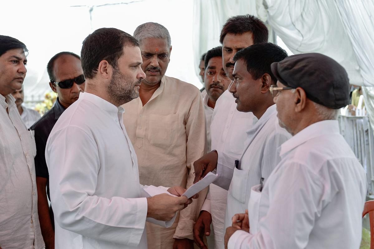 President Rahul Gandhi meets with people at Gauriganj, on the second day of his visit to Amethi on Thursday, July 5, 2018. (PTI Photo)