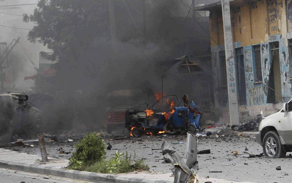 A car burns after the blast in Mogadishu, Somalia, on Saturday, July, 7, 2018. At least nine people were killed in the attack on Somalia's interior ministry, and security forces killed all three attackers after a two-hour gun battle inside, police said Saturday, as the al-Shabab extremist group claimed responsibility.AP/PTI
