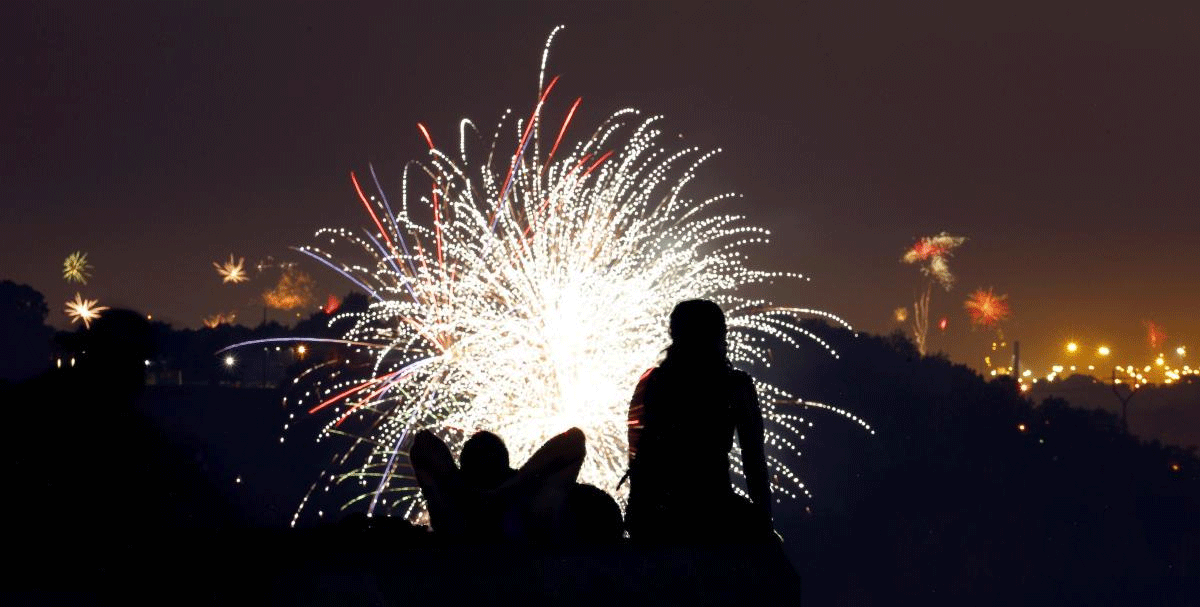 A couple watches fireworks set off by private citizens to celebrate Independence Day, from a vantage point at the Liberty Memorial on Wednesday, July 4, 2018, in Kansas City, Mo. AP/PTI