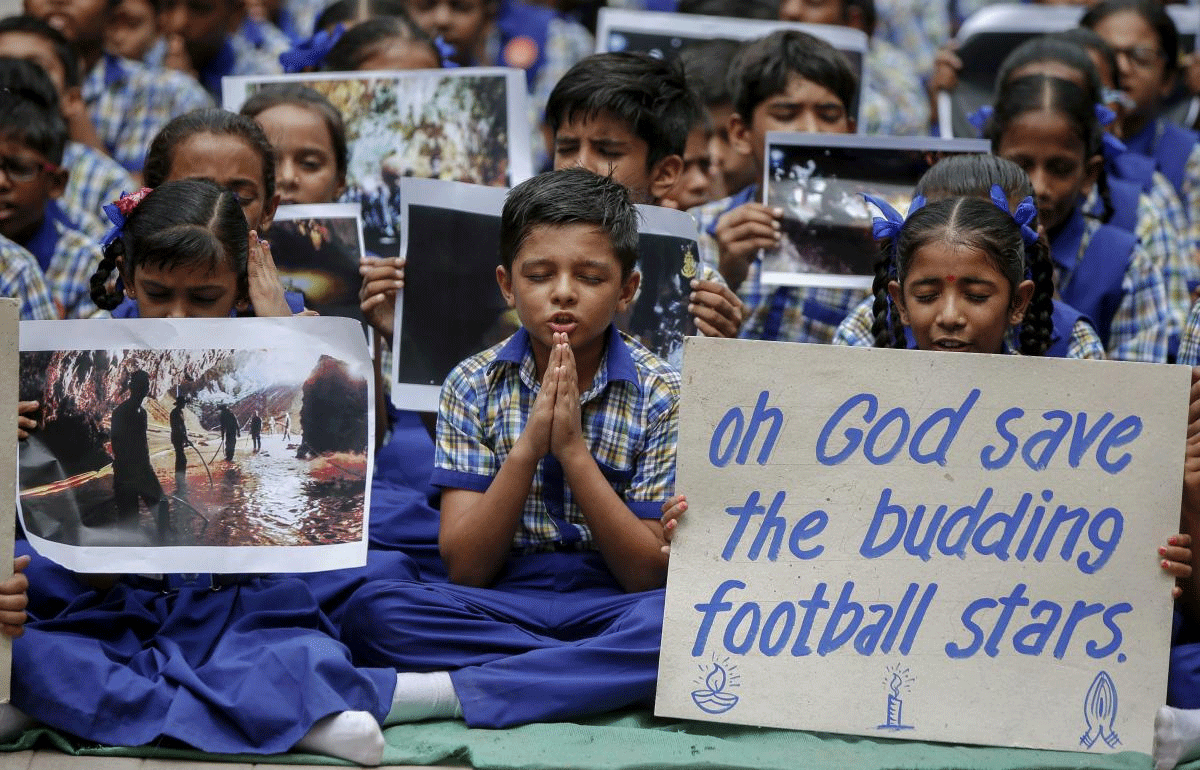School students play for the well-being of 12 soccer players and their coach who were trapped in a cave in northern Thailand as the second phase of the rescue takes place, in Ahmedabad on Monday, July 09, 2018. (PTI Photo)