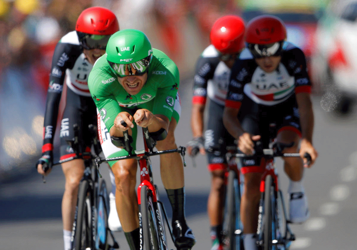 Tour de France - The 35.5-km Stage 3 Team Time Trial from Cholet to Cholet - July 9, 2018 - UAE Team Emirates rider Alexander Kristoff of Norway finishes in the green jersey with teammates. REUTERS