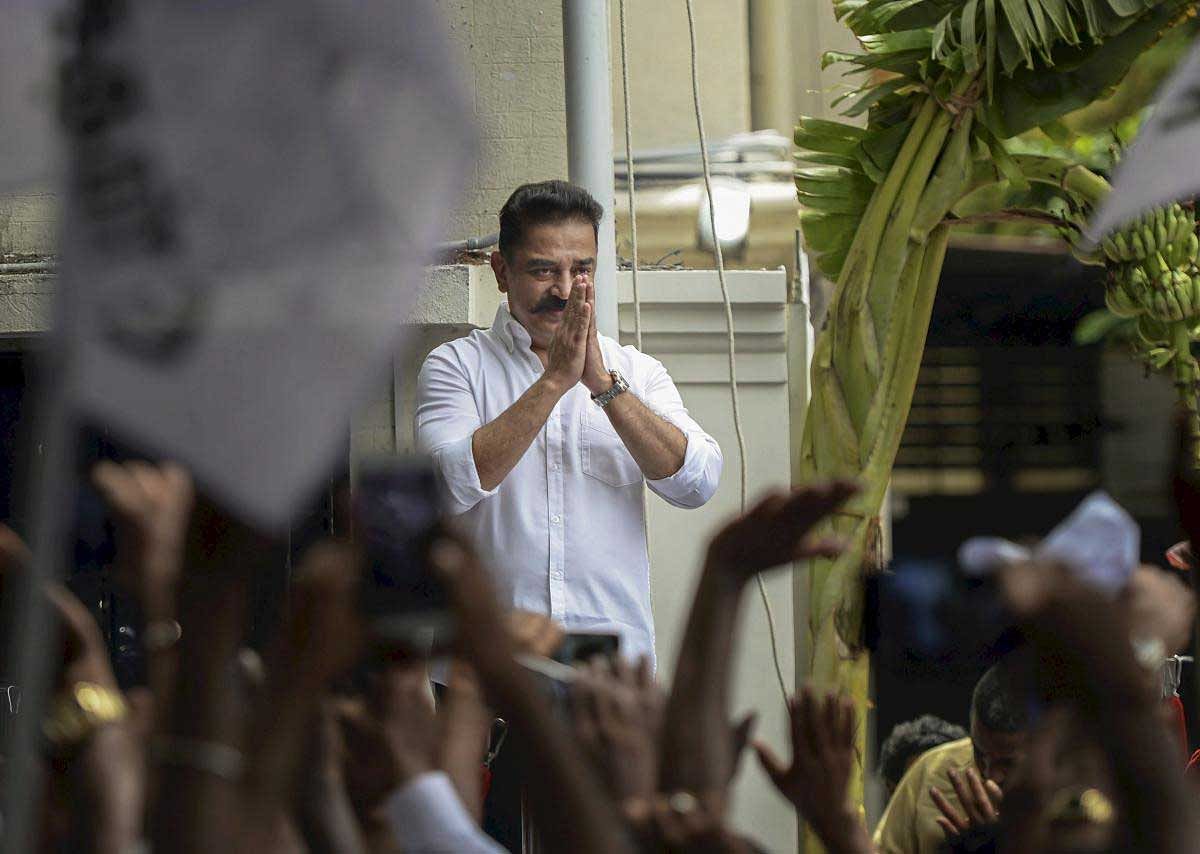 Makkal Needhi Maiam (MNM) chief Kamal Haasan greets his supporters during a meeting at the party office in Alwarpet, in Chennai on Thursday, July 12, 2018. (PTI Photo)