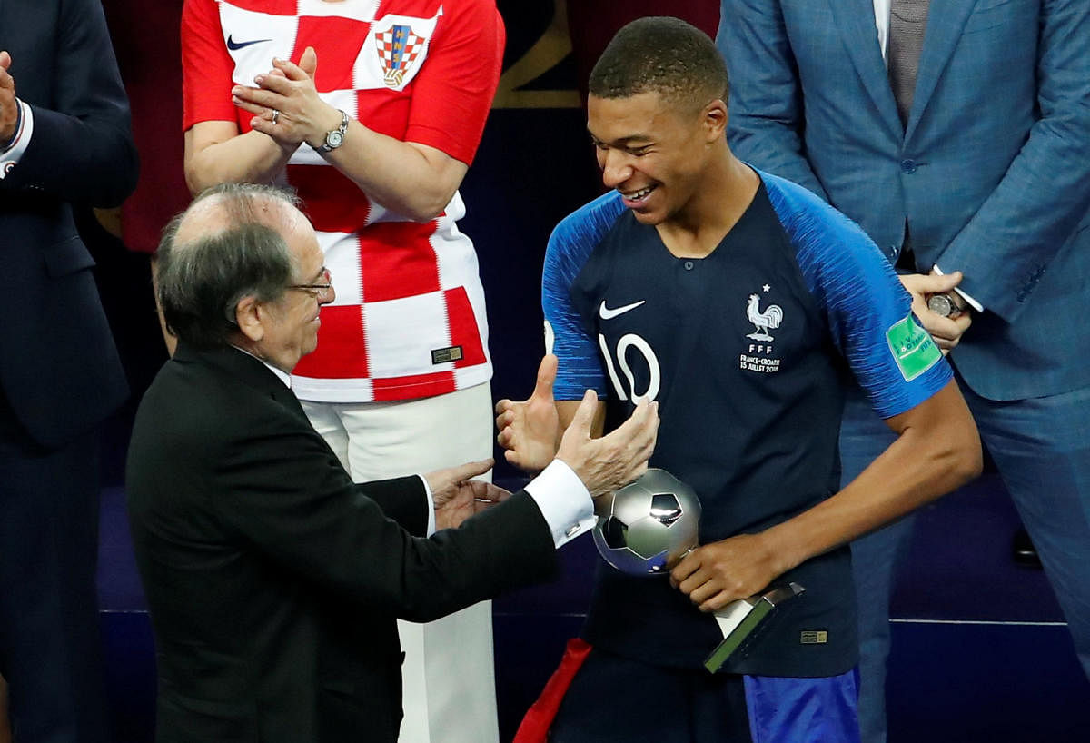 World Cup - Final - France v Croatia - Luzhniki Stadium, Moscow, Russia - July 15, 2018 France's Kylian Mbappe is awarded the Best Young Player trophy. Reuters