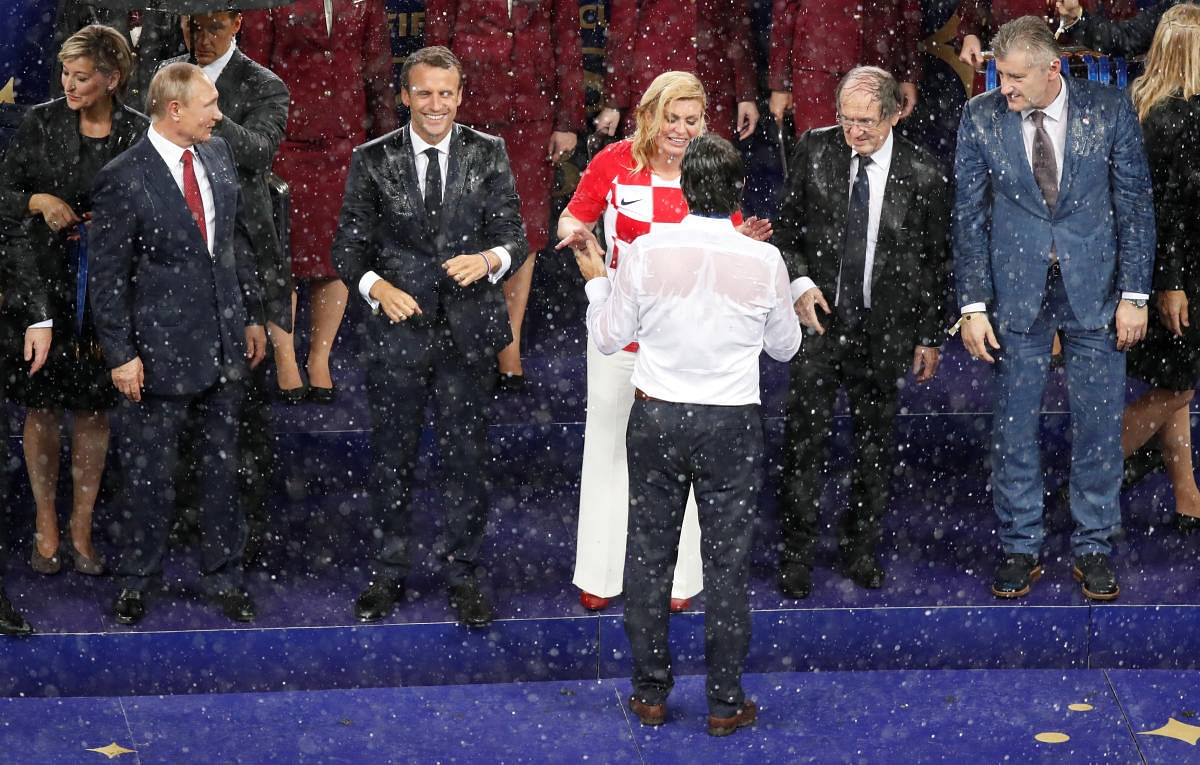 World Cup - Final - France v Croatia - Luzhniki Stadium, Moscow, Russia - July 15, 2018 Croatia coach Zlatko Dalic shakes hands with Croatia President Kolinda Grabar-Kitarovic. Reuters