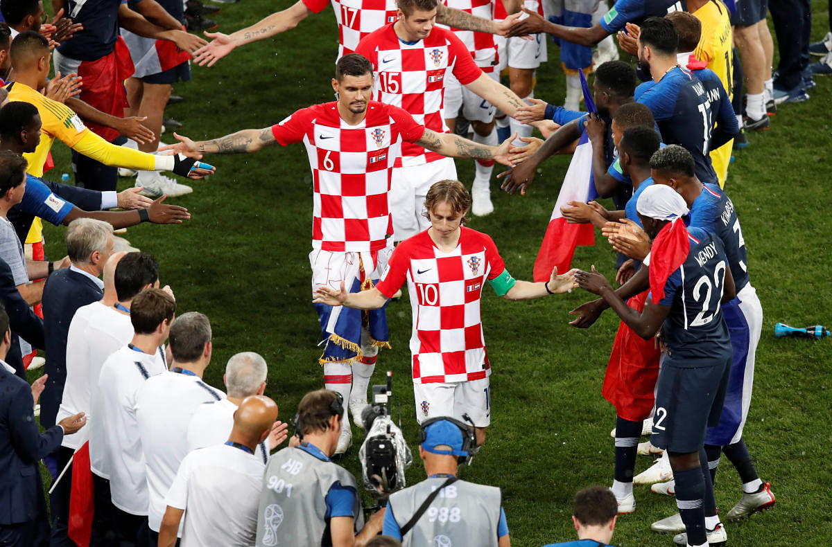 World Cup - Final - France v Croatia - Luzhniki Stadium, Moscow, Russia - July 15, 2018 Croatia players shake hands with France players. Reuters