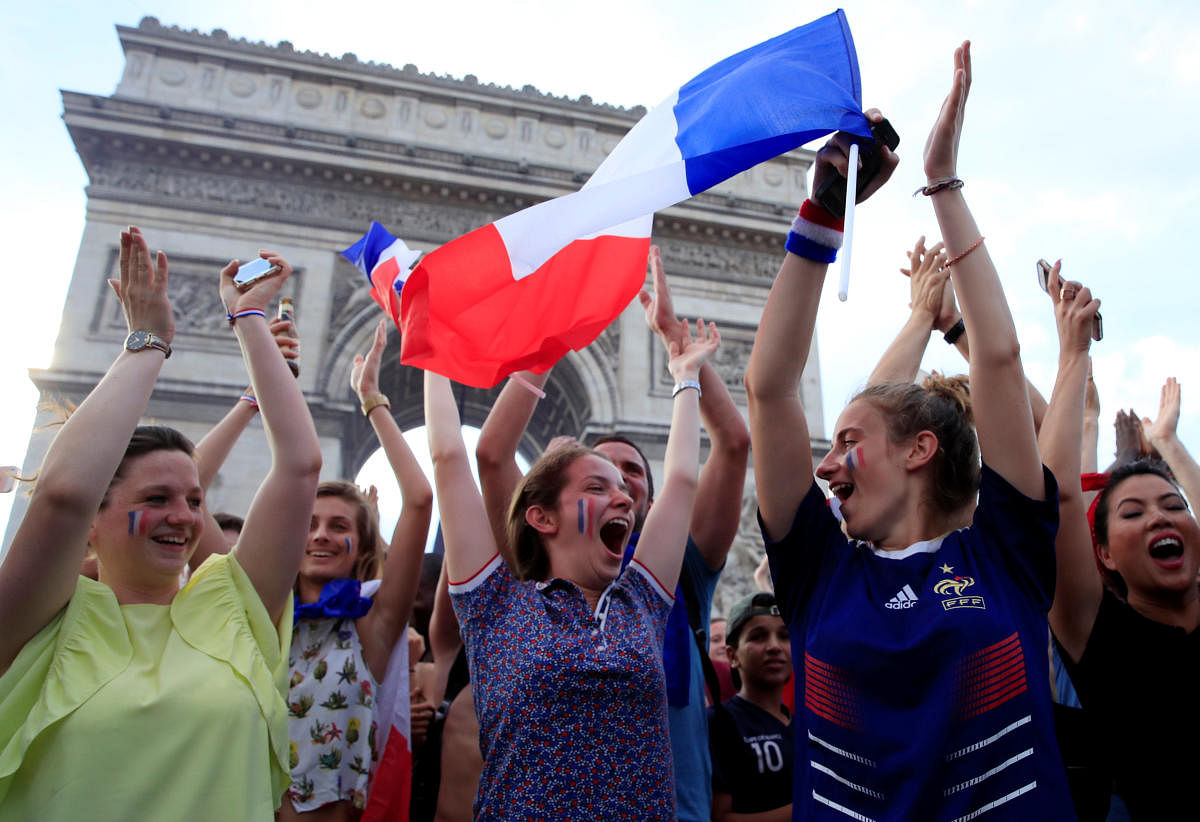 World Cup - Final - France vs Croatia - Paris, France, July 15, 2018 - France fans react on the Champs-Elysees avenue after they defeated Croatia in their Soccer World Cup final match. Reuters