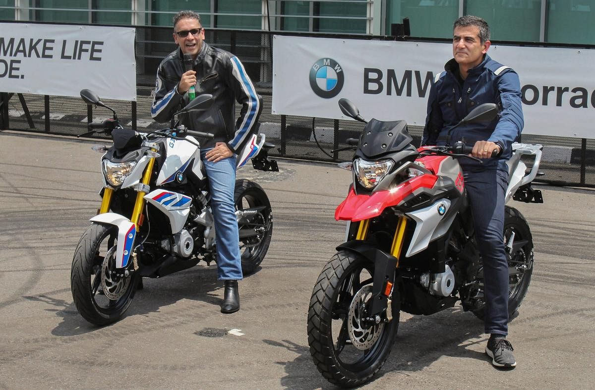 BMW Group India President Vikram Pawah (L) and BMW Motorrad Head of Region Asia, China, Pacific, South Africa, Dimitris Raptis launch the new motorcycles G310R and G310GS, in Gurugram on Wednesday. (PTI Photo)