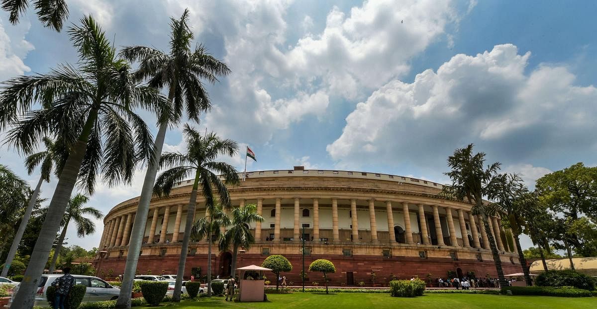 Clouds hover over Parliament House on the first day of the Monsoon Session of Parliament, in New Delhi on Wednesday. (PTI Photo/Vijay Verma)