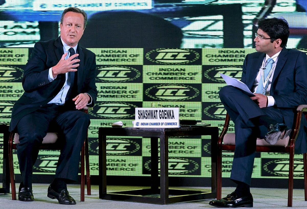 Former British Prime Minister David Cameron speaks with ICC President Shashwat Goenka during ICC Annual session and 90th Annual General meeting, in Kolkata on Thursday. (PTI Photo)