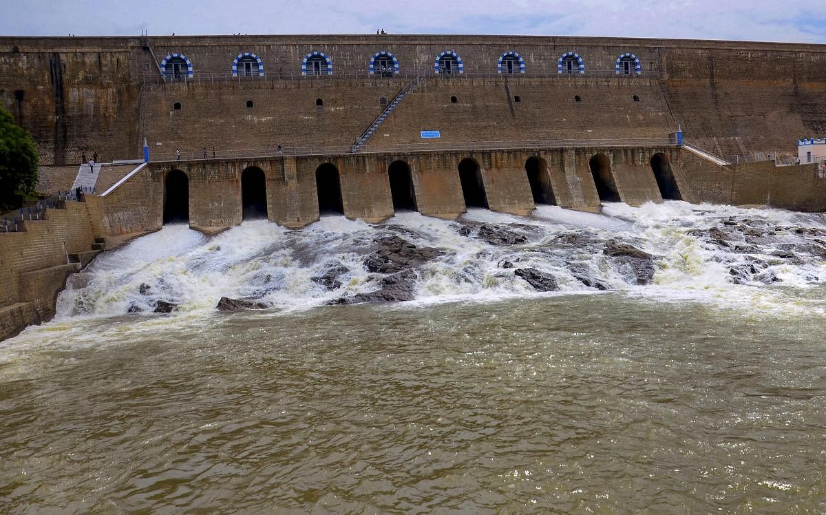 Water being released from the Mettur Dam after gates were opened on Thursday. (PTI Photo)