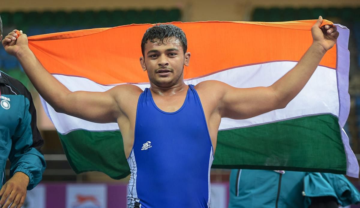 Wrestler Deepak Punia celebrates after winning gold in the Free Style (86kg category) during the 2018 Junior Asian Wrestling Championship, in New Delhi. (PTI Photo)