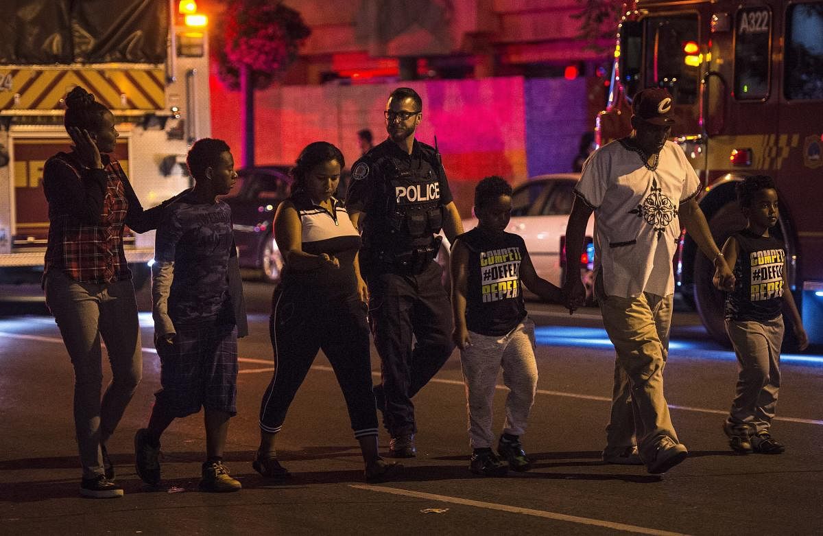 Police escort civilians away from the scene of a shooting in Toronto. (AP/PTI  Photo)