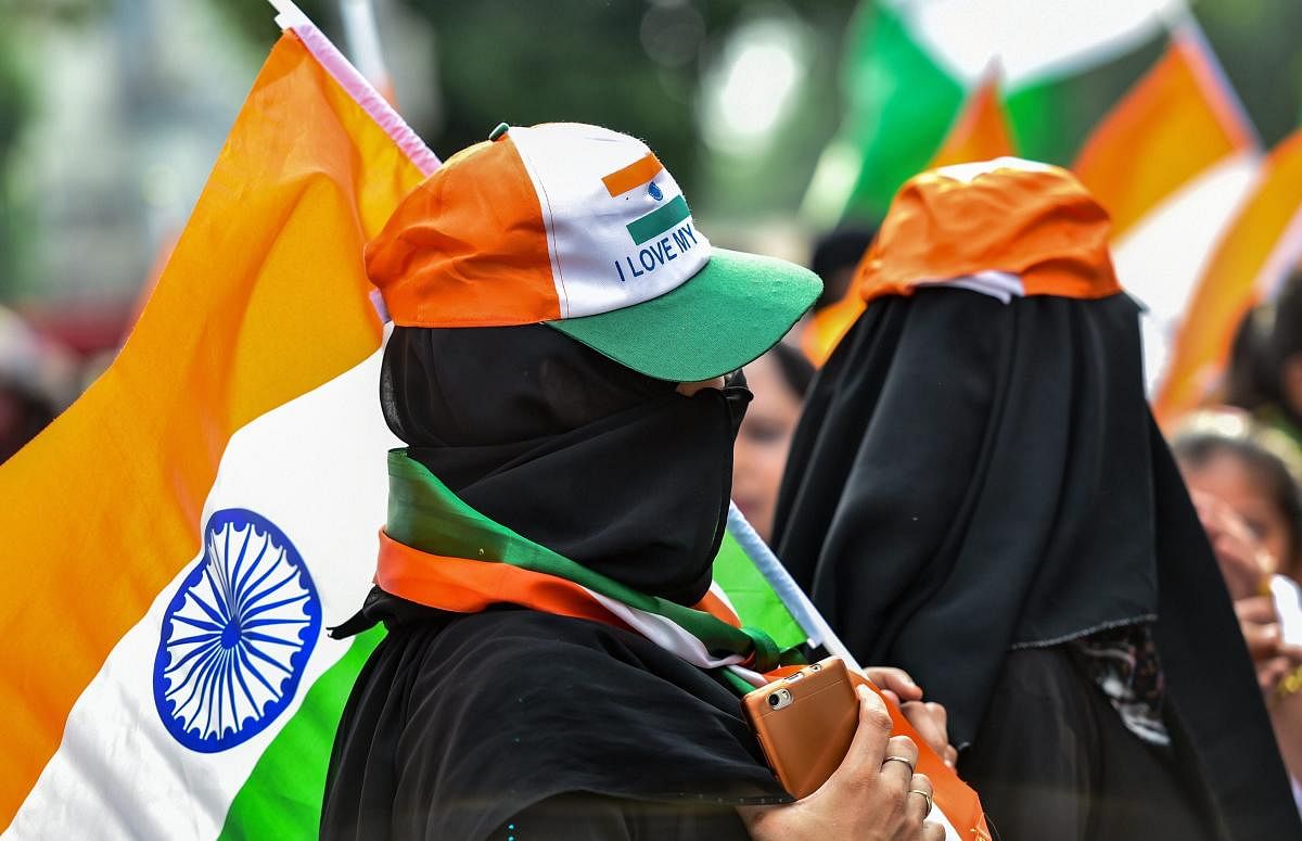 Muslim women take part in the Tiranga March (Flag March) on the occasion of the 72nd Independence Day. (PTI Photo)