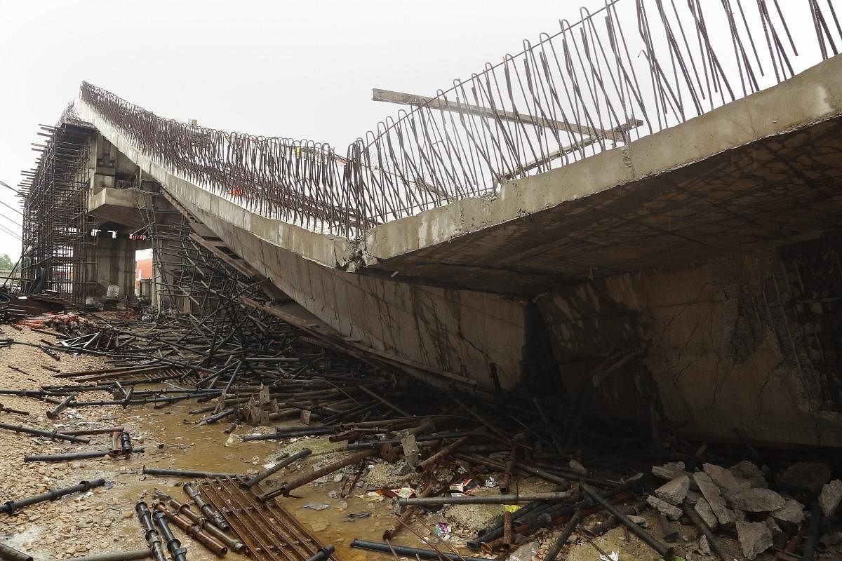 An underconstruction flyover collapses in Basti district. (PTI Photo)