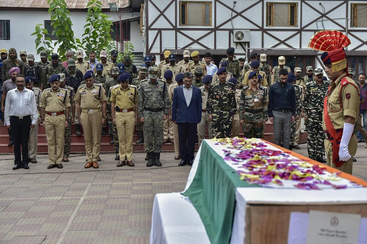 Senior army, CRP, police and civil officers pay tribute to slain SG Constable Parvaiz Ahmad during his wreath-laying ceremony at District Police Lines, in Srinagar, on Sunday, August 12, 2018. According to the officials, Ahmad was killed and five other security forces personnel were injured during an encounter in the Batamaloo area following which two ultras were arrested. (PTI Photo/S Irfan)