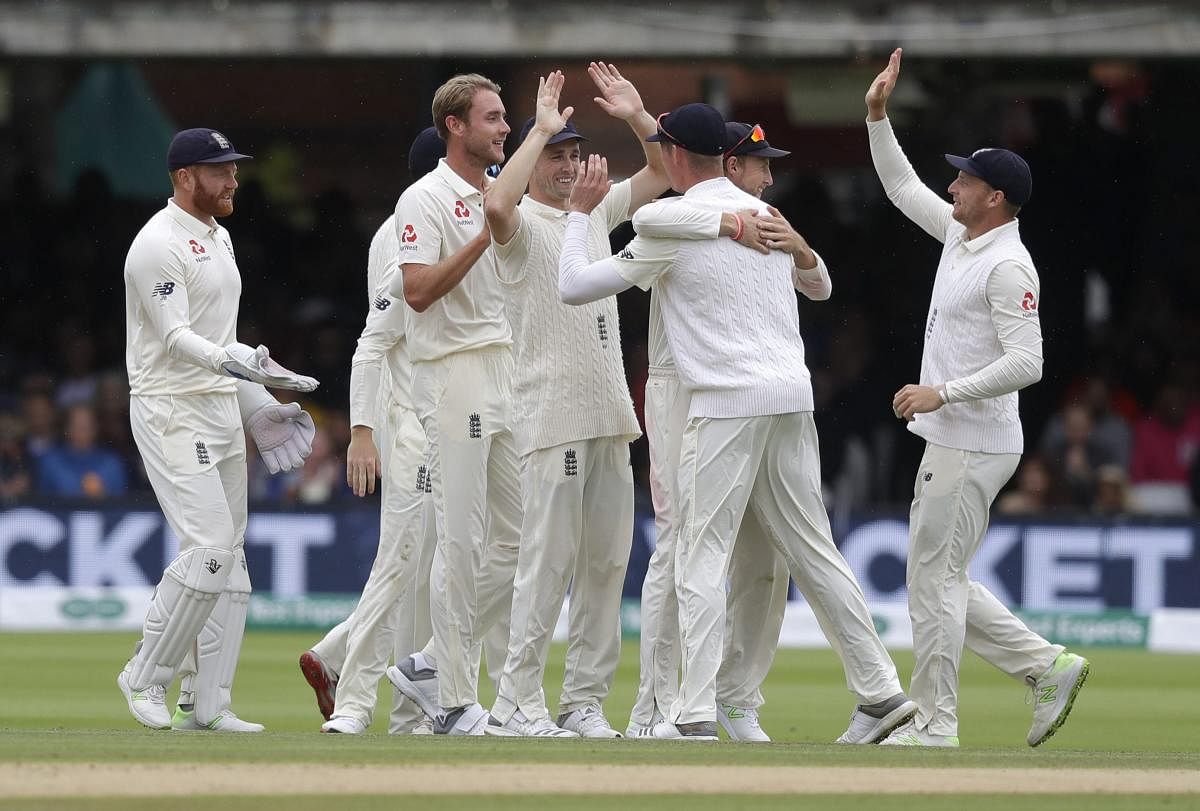 England players celebrate taking the wicket of India's Ajinkya Rahane during the fourth day of the second test match between England and India at Lord's cricket ground in London, Sunday, Aug. 12, 2018. AP/PTI