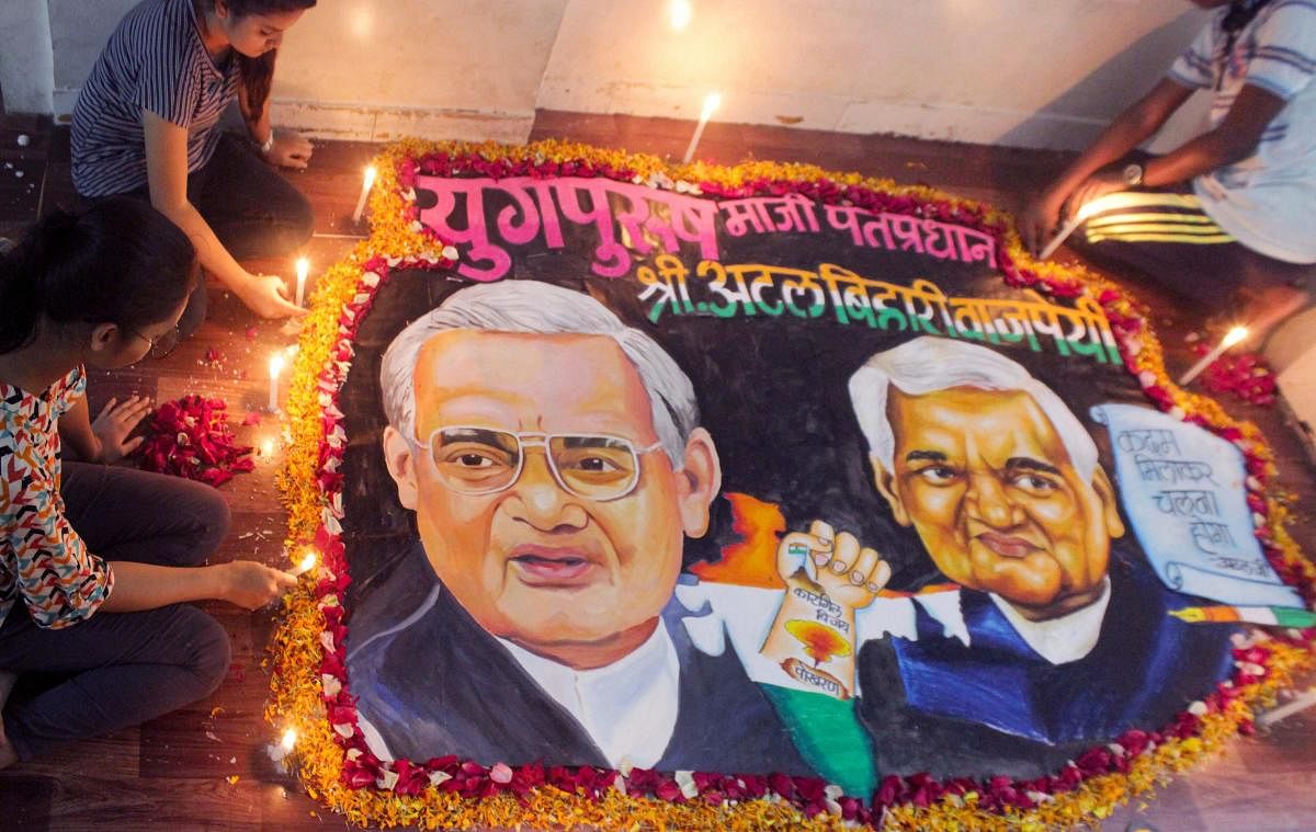 School students prepare a rangoli to pay tribute to former prime minister Atal Bihari Vajpayee, in Mumbai on Thursday, Aug 16, 2018. Vajpayee, 93, passed away at AIIMS hospital after a prolonged illness. (PTI Photo)