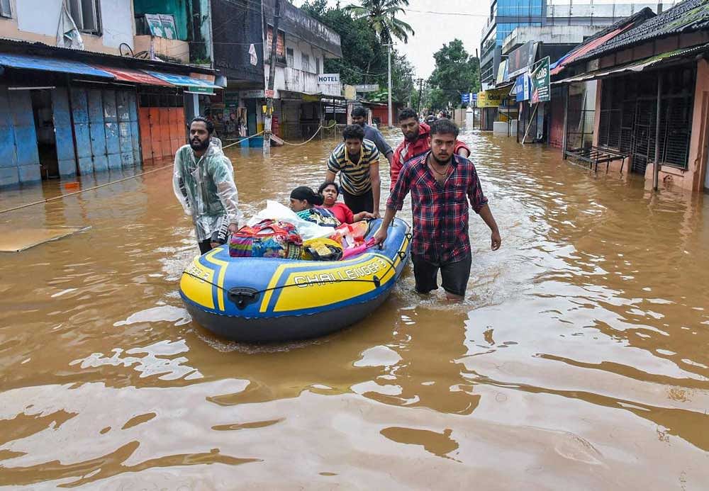 People being rescued from flood-affected regions following heavy monsoon rainfall, in Kochi. PTI Photo