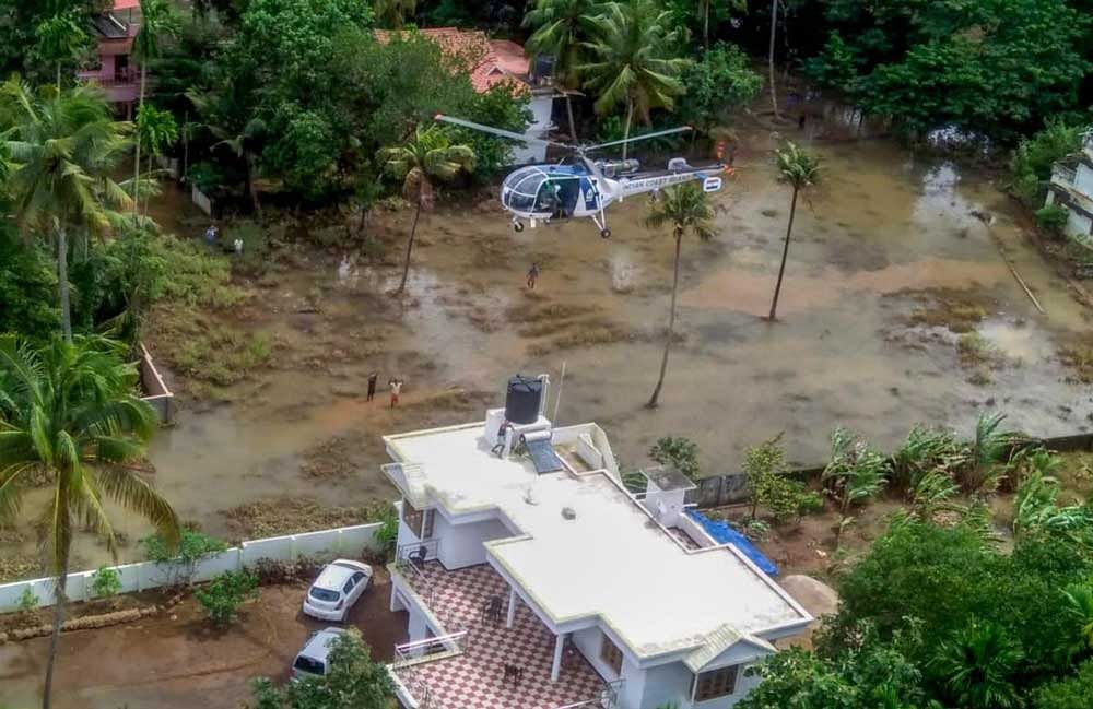 An Indian Coast Guard chopper during the rescue and relief operations in the flood-affected areas of Ernakulam and Kottayam districts of Kerala. PTI