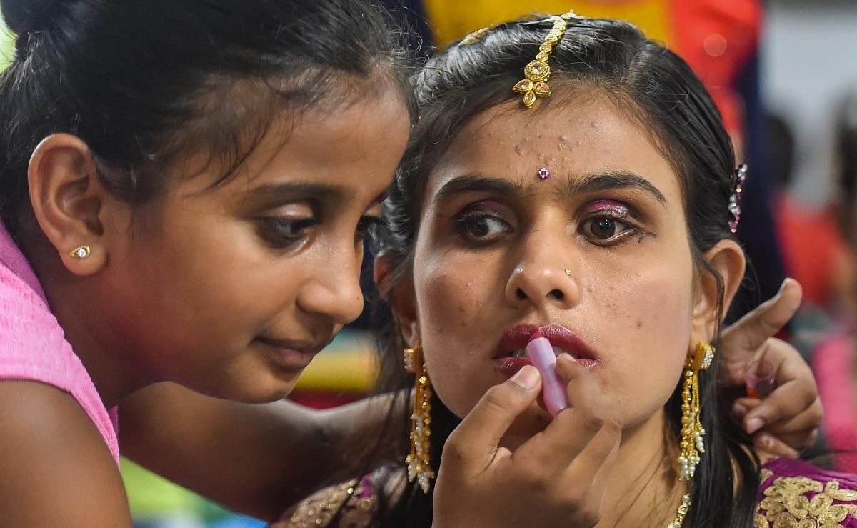 A visually-impaired woman has make-up applied during an event 'Bridal Make Up' competition, organised by Blind People's Association, in Ahmedabad on Friday, Aug 24, 2018. PTI