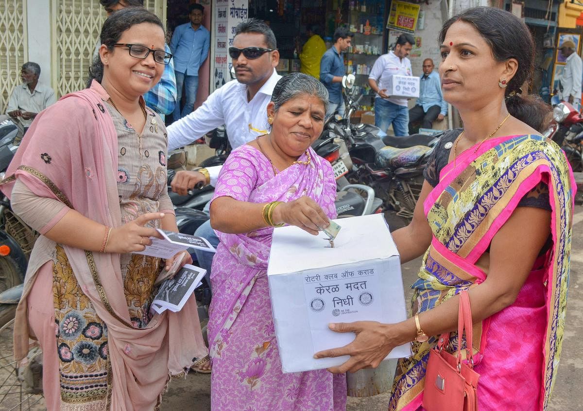 People donate fund for Kerala floods at a Rotary Club's relief rally in Karad, Maharashtra on Friday, Aug 24, 2018. PTI