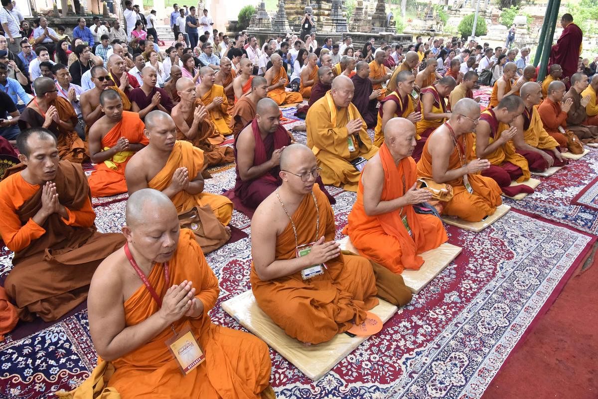 Foreign delegates participating in International Buddhist Conclave offer prayers at Maha Bodhi temple, in Bodh Gaya on Sunday, Aug 26, 2018.