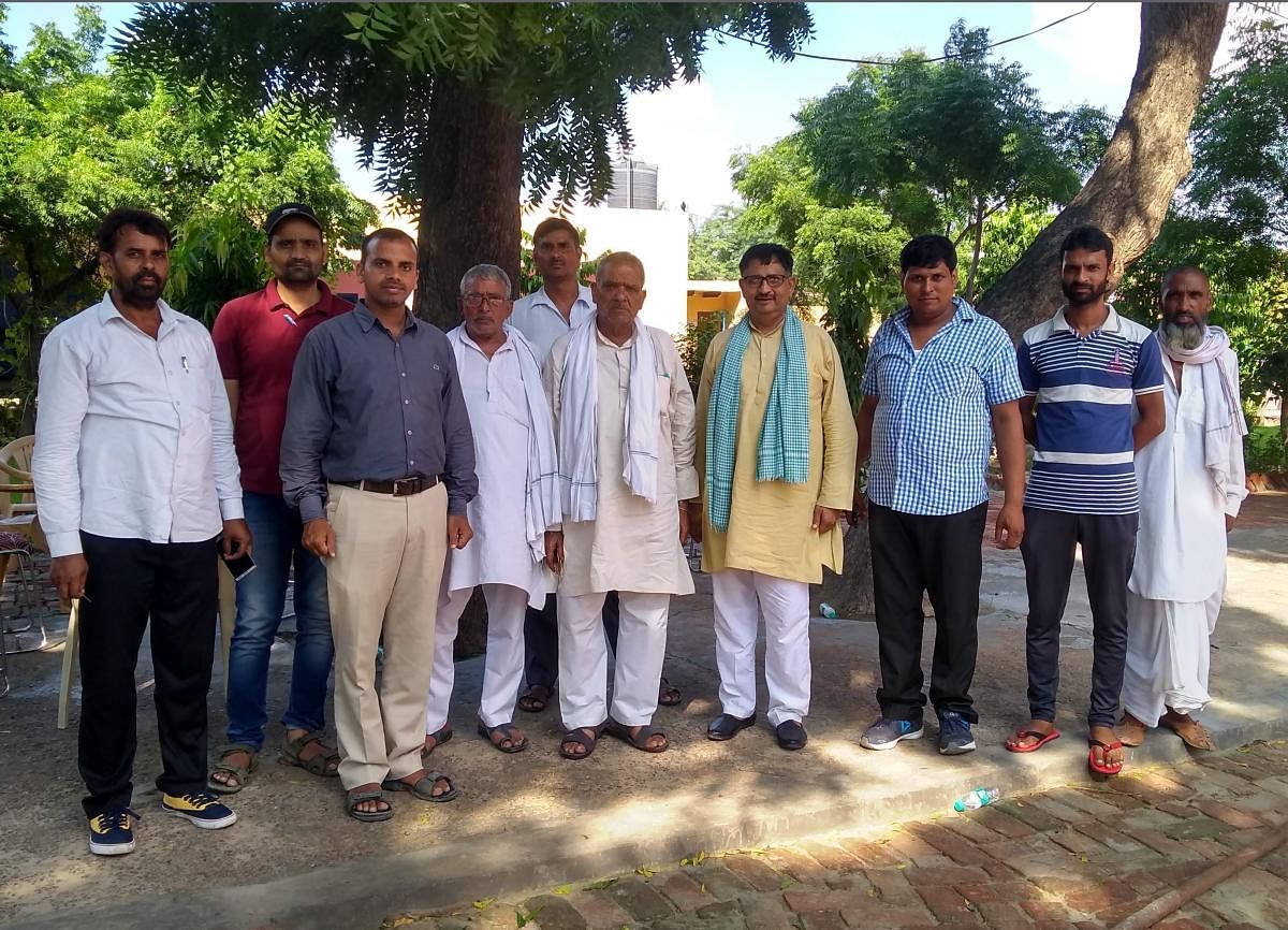 Locals of Ranhera village in Jewar where land is to be acquired for a proposed international airport, in Jewar.