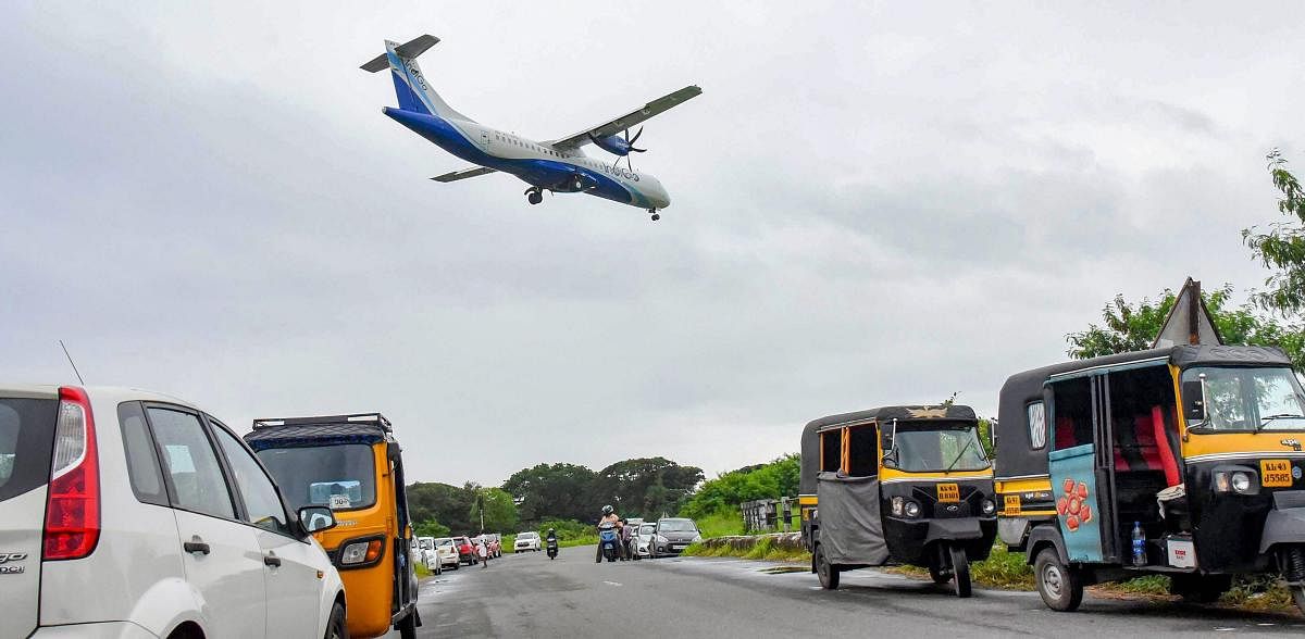 A commercial flight on its way to land at the naval airbase INS Garuda in Kochi on Monday, August 27, 2018. PTI