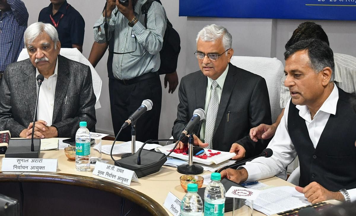 Chief Election Commissioner OP Rawat, flanked by Election Commissioners Ashok Lavasa (R) and Sunil Arora, holds a meeting with the district administration officials ahead of the State Assembly elections, in Bhopal on Tuesday, Aug 28, 2018.