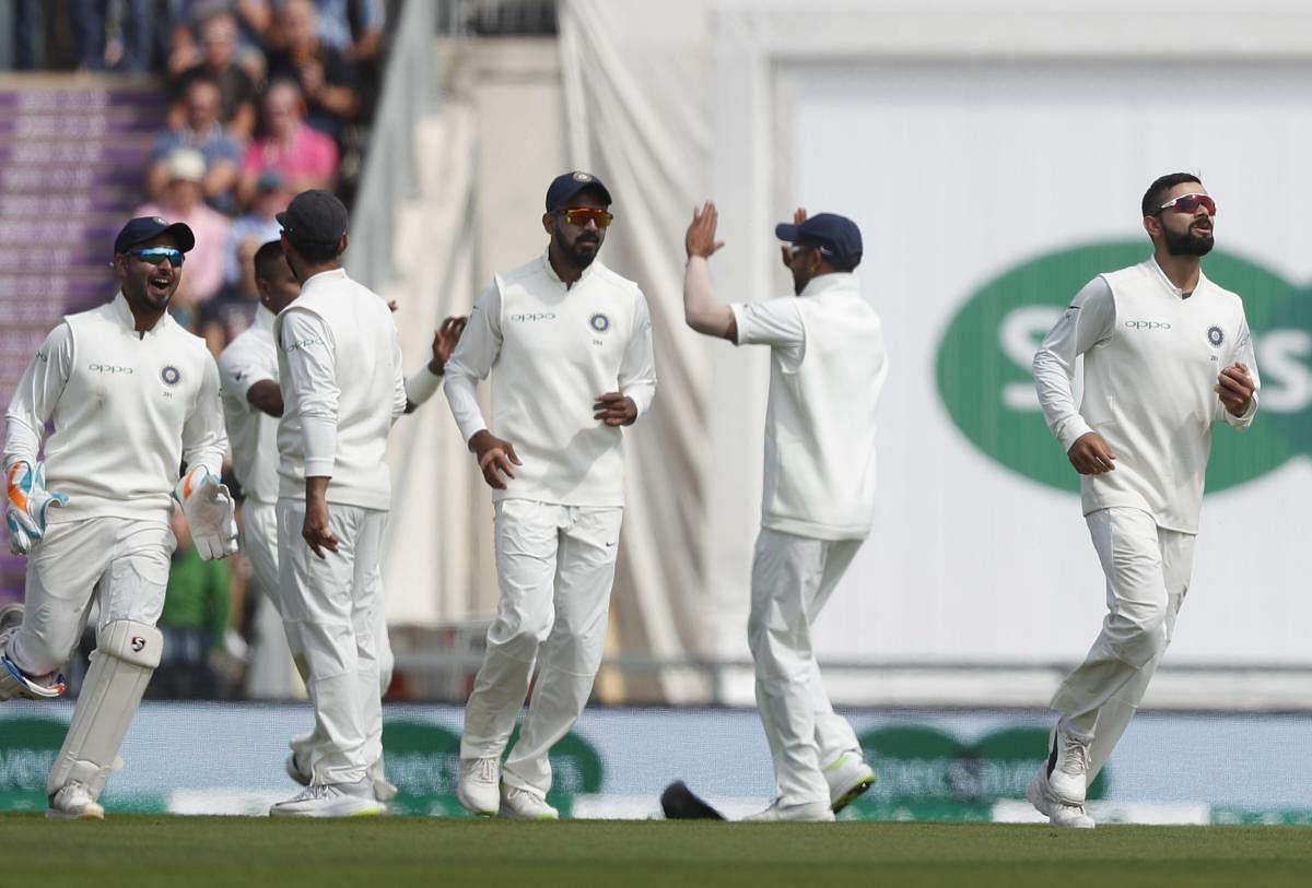India's Virat Kohli, right, celebrates after he catches England's Alastair Cook out, off the bowling of India's Hardik Pandya during play on the first day of the 4th cricket test match between England and India at the Ageas Bowl in Southampton, England, Thursday, Aug. 30, 2018. England and India are playing a 5 test series. AP/PTI