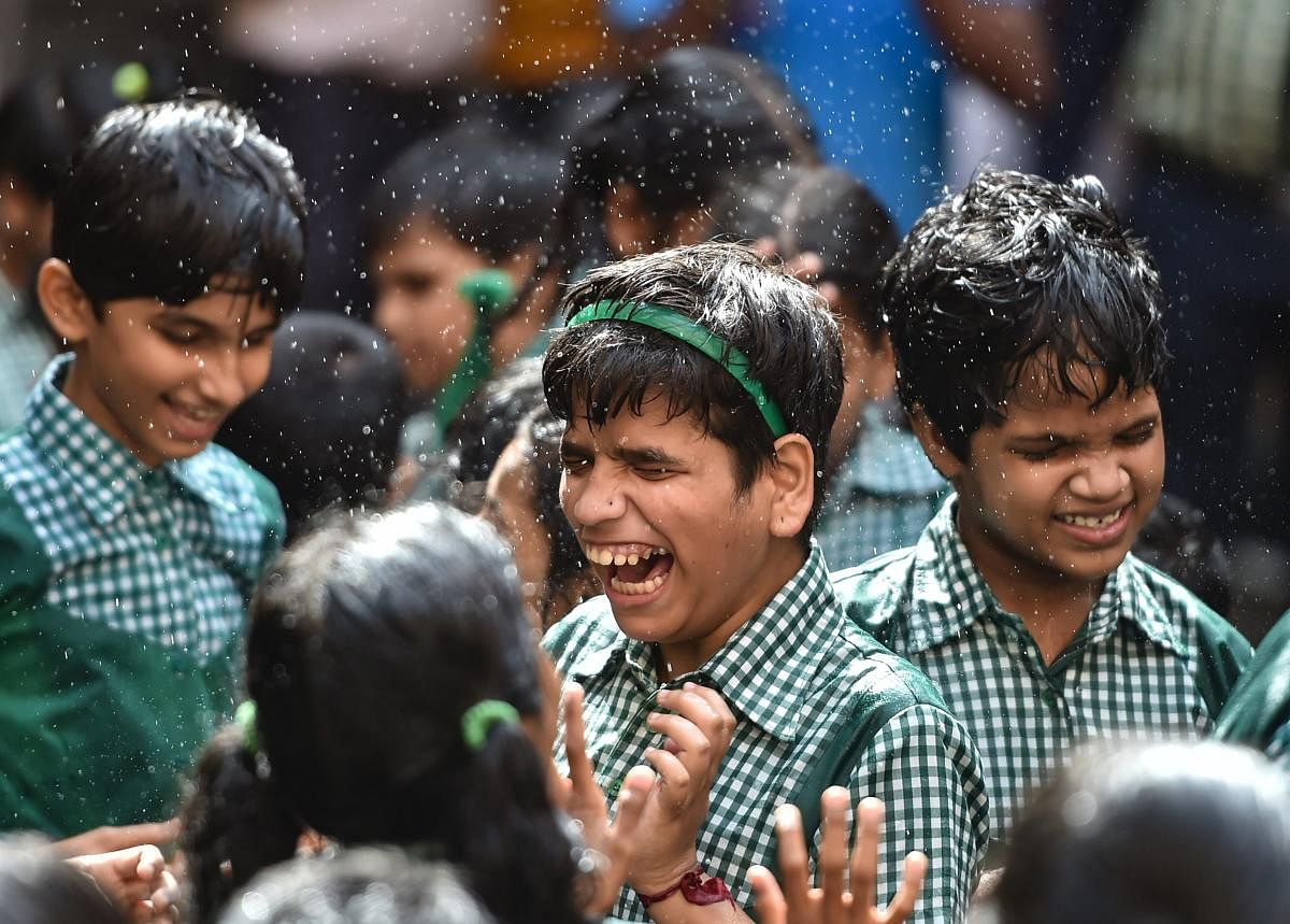 Differently abled children participate in a 'Dahi Handi' event during Janmashtami celebrations at a school in Mumbai on Friday, August 31, 2018. (PTI Photo /Mitesh Bhuvad)