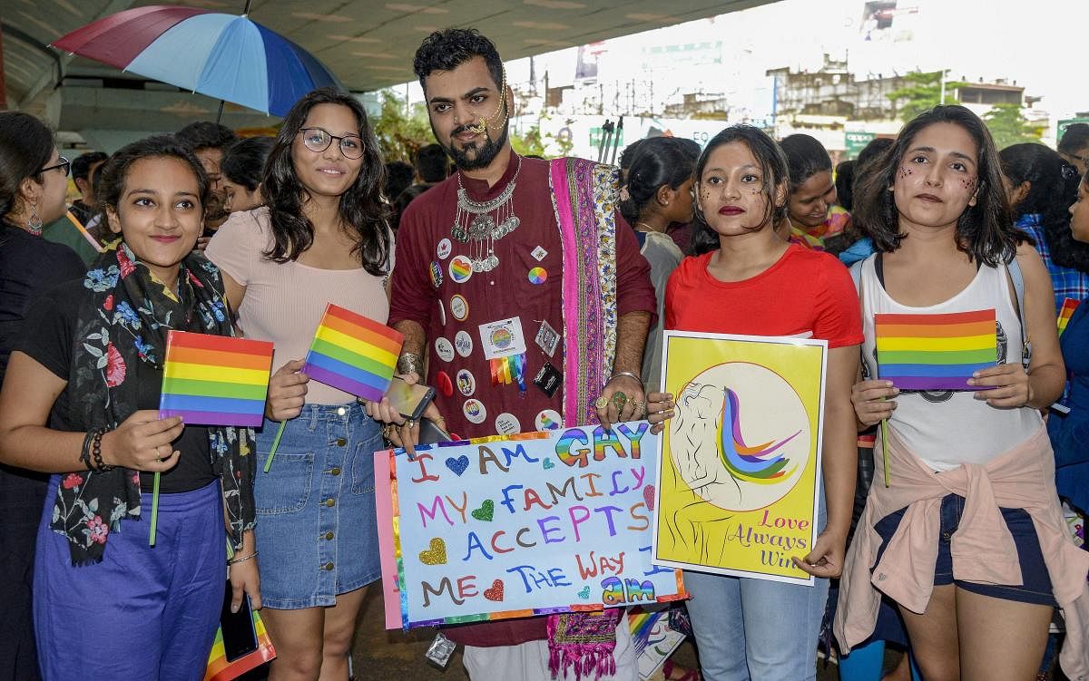College students hold placards as they participate in Pride March, in Bhubaneswar on Saturday, Sept 1, 2018. (PTI Photo)