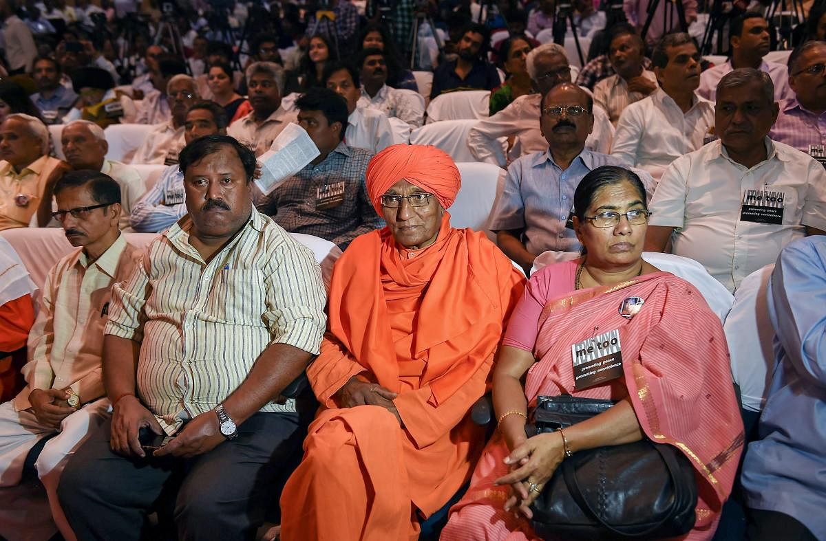 Social activist Swami Agnivesh with others during the 'Freedom of Expression Meet' organised on the occasion of first death anniversary of journalist Gauri Lankesh, in Bengaluru, Wednesday, Sept 5, 2018. (PTI Photo/Shailendra Bhojak)