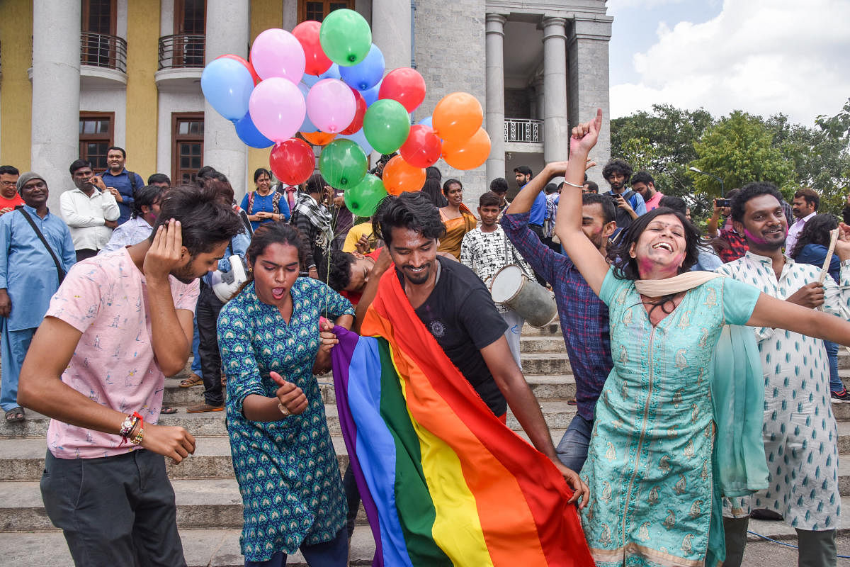 Supporters of the LGBT community celebrate after the Supreme Court's verdict of decriminalizing gay sex and revocation of the archaic Section 377 law, in front of Town Hall in Bengaluru. (DH Photo)
