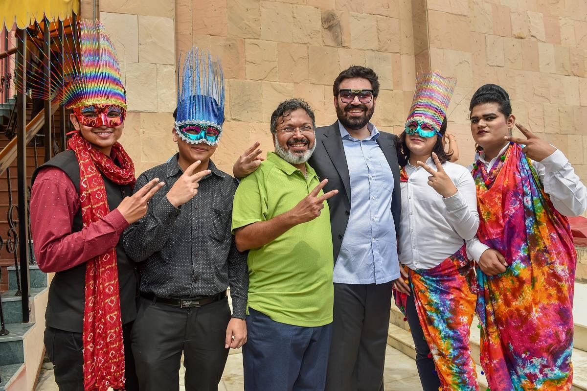 Hotelier Keshav Suri (3rd R), one of the petitioners in the Section 377 case, along with other LGBTQ activists react as they celebrate the Supreme Court verdict that decriminalises the consensual gay sex, in New Delhi. (PTI Photo)