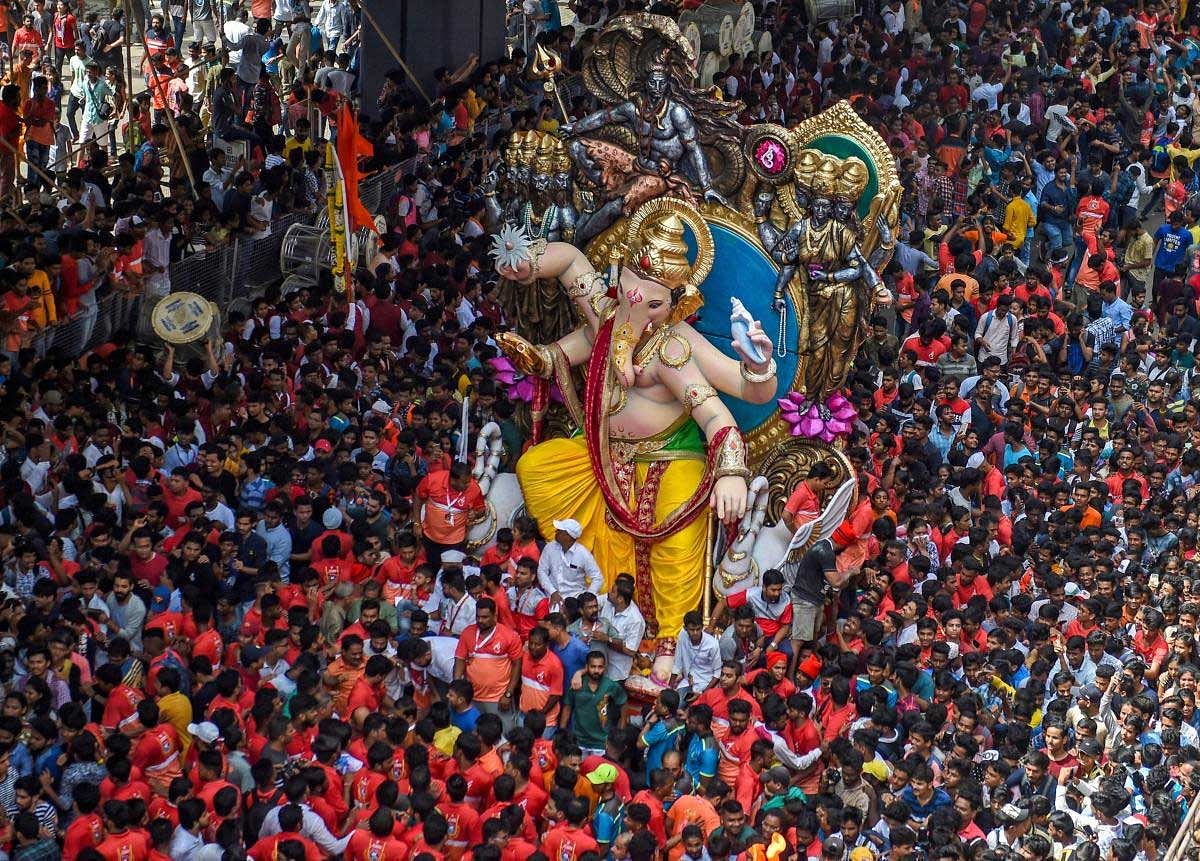 Devotees carry a Ganesha idol to be installed at a pandal ahead of Ganpati festival, in Mumbai on Saturday, Sept 8, 2018. PTI Photo