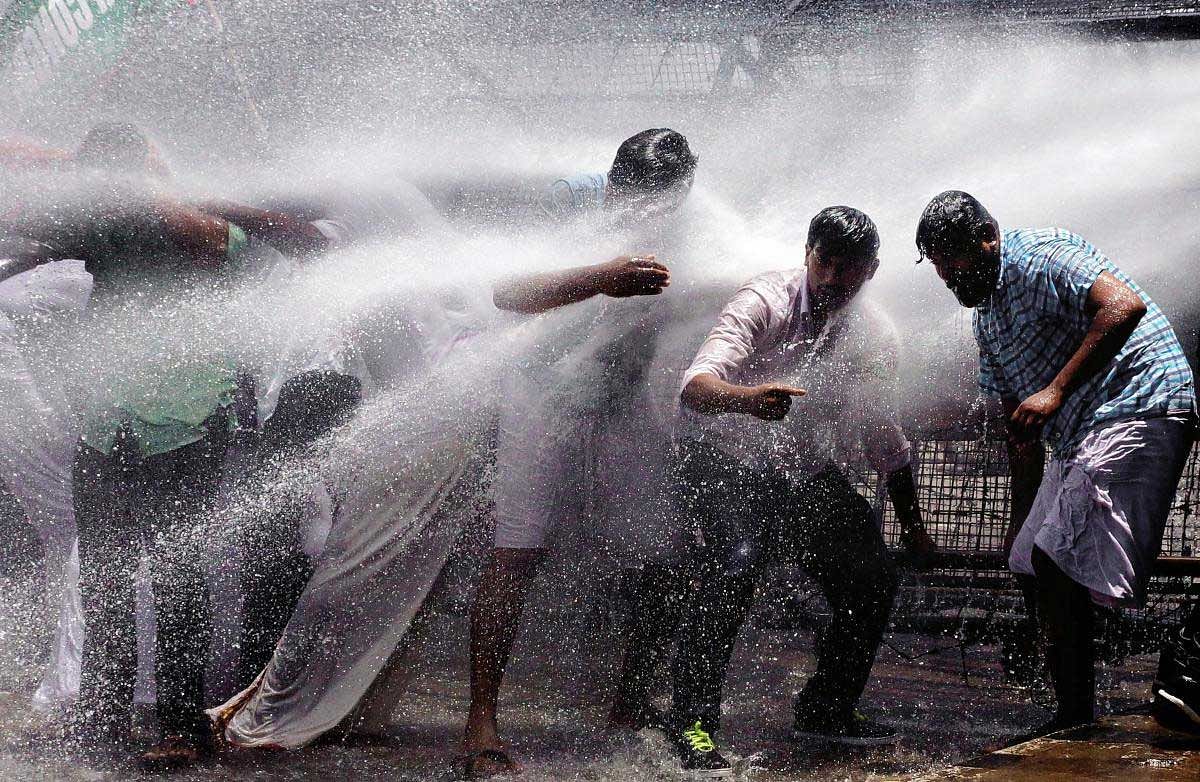 Youth Congress workers being sprayed by water canons during their protest march against alleged laxity by officials in taking action against PK Sasi, the ruling party MLA facing a molestation charge, in Thiruvananthapuram, Friday, Sept 7, 2018. (PTI Photo)