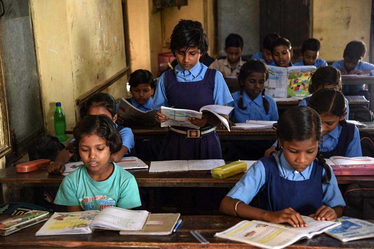 Children attend a class at a Government school on the occasion of 'World Literacy Day', in Allahabad, Saturday, Sept 8, 2018. (PTI Photo)