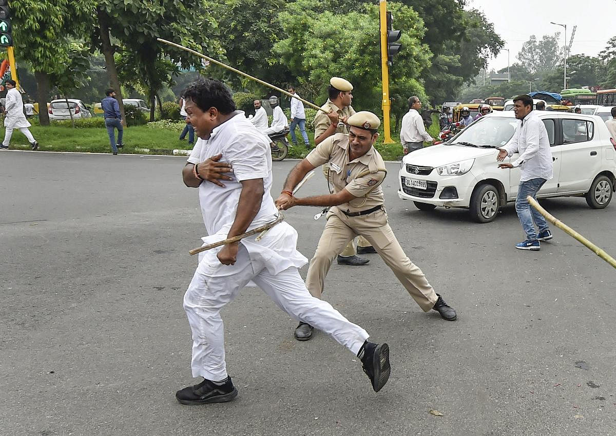 Policemen lathi-charge on members of Indian Youth Congress protesting during 'Bharat Bandh', against fuel price hike and depreciation of the rupee, in New Delhi, Monday, Sept 10, 2018. PTI Photo