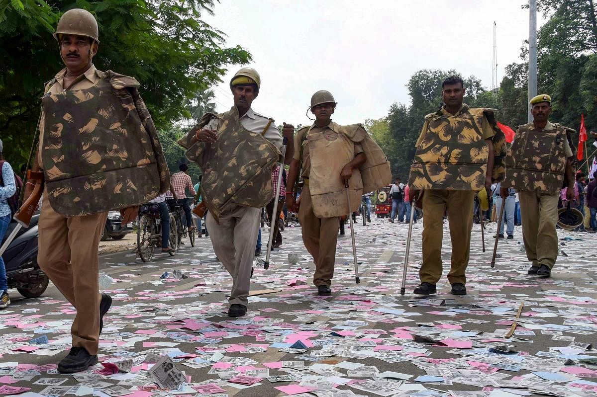 Allahabad: Police arrive to control the situation after a clash between two students' groups during nomination filing for Allahabad University Students elections, in Allahabad, Wednesday, Sept 26, 2018. (PTI Photo)