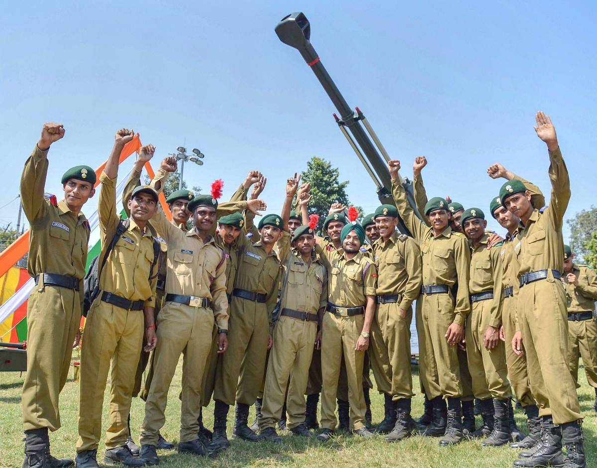 NCC cadets pose for photos during an event to commemorate 'Parakram Parv', in Jabalpur. (PTI Photo)