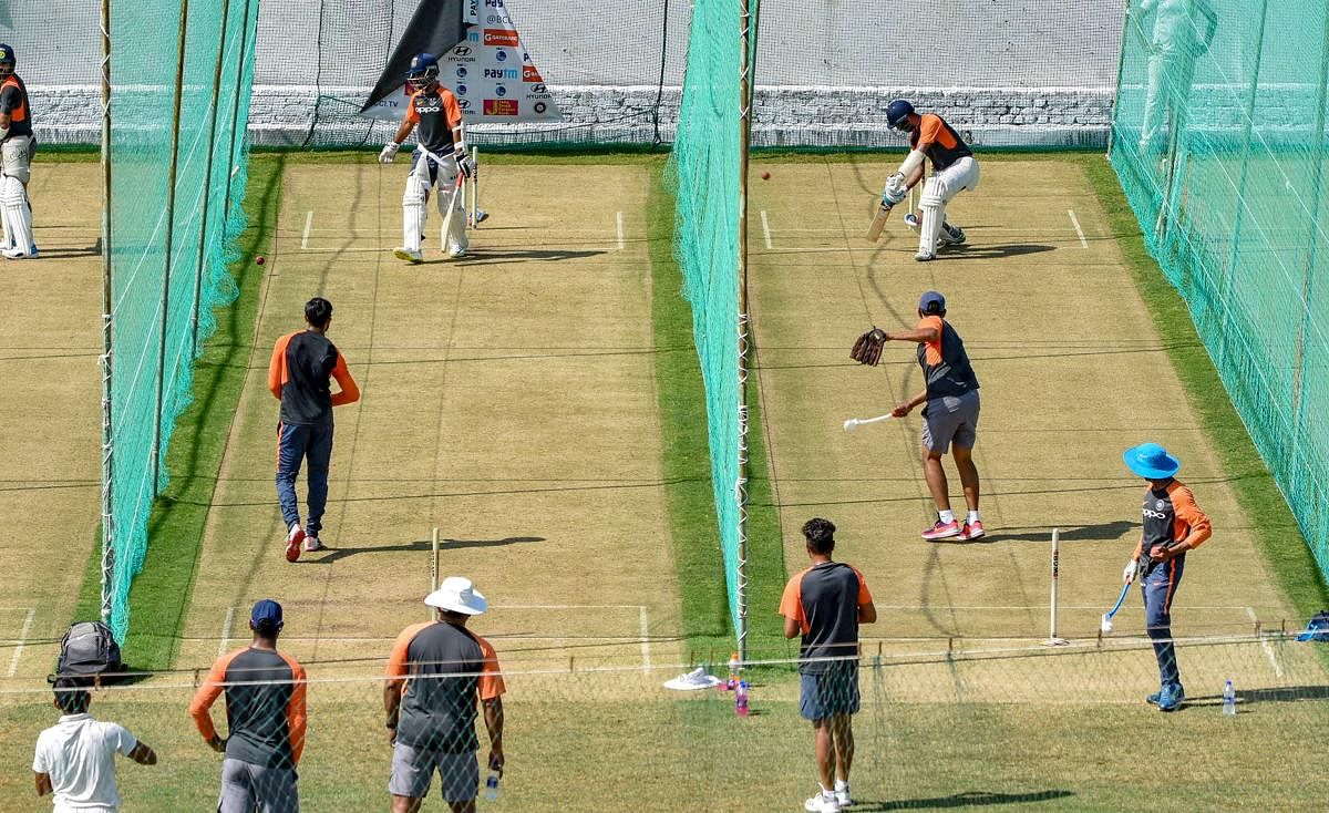Indian cricket team practice ahead of their first match in the India-West Indies test series, in Rajkot. (PTI Photo)