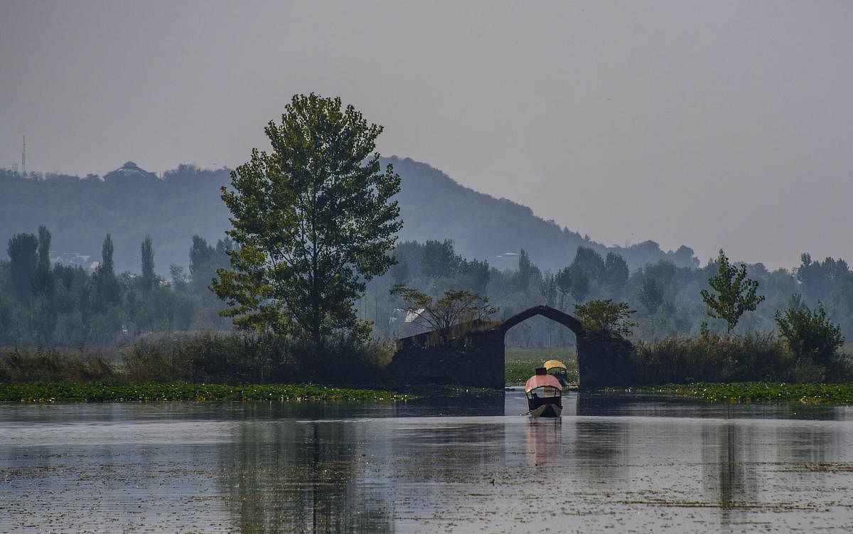 A view of the 17th century Mughal-era camel hump shaped bridge ‘Oonth Kadal’, situated in the middle of the famous Dal Lake in Srinagar. (PTI Photo)