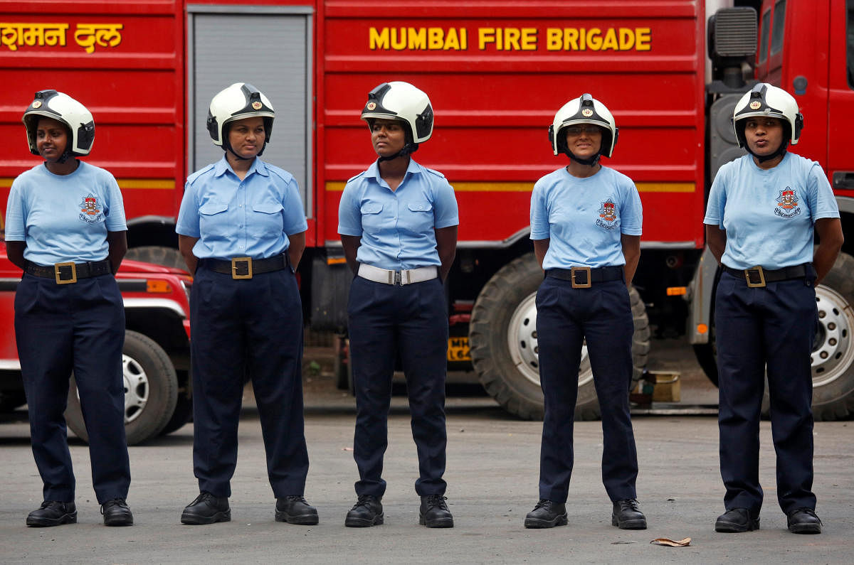Female firefighters stand in a line during a drill at a fire station in Mumbai. (Reuters Photo)