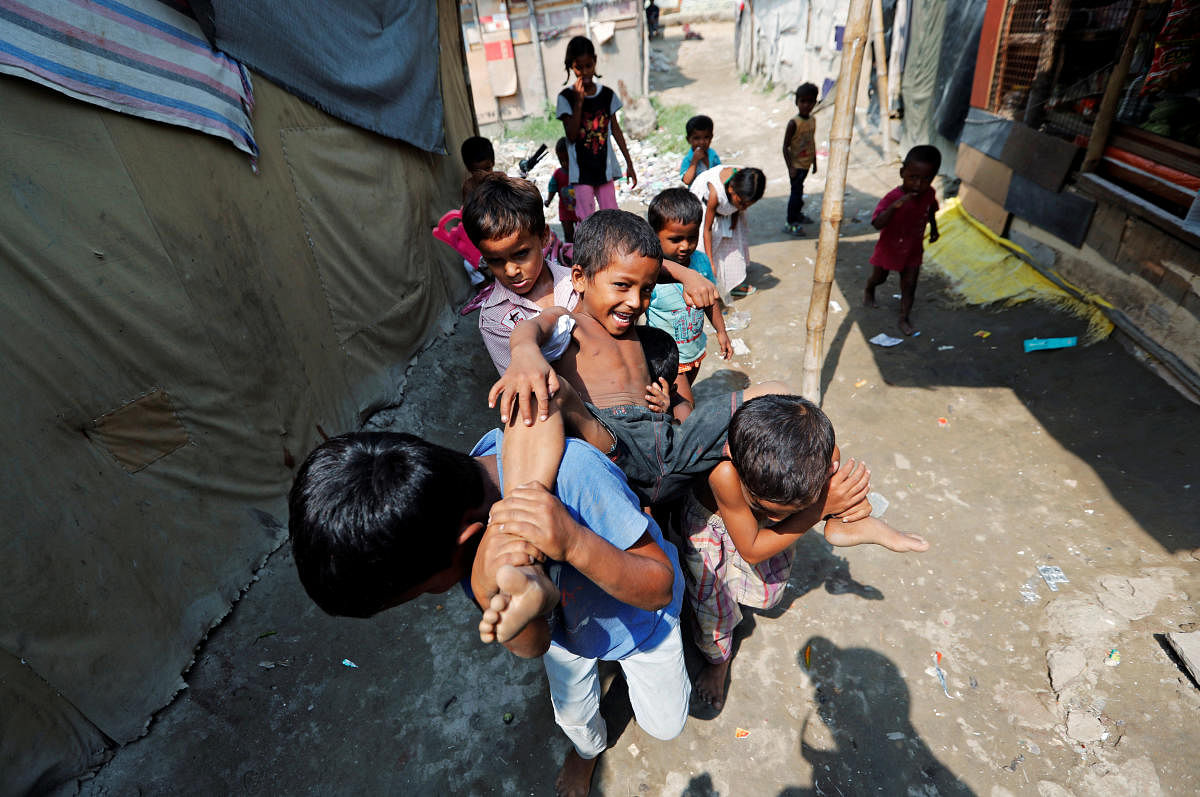 Children from the Rohingya community play outside their shacks in a camp in New Delhi. (Reuters Photo)