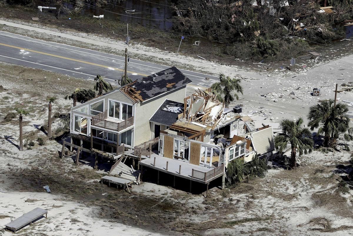 Homes destroyed by Hurricane Michael are shown in this aerial photo in Mexico Beach, Fla. The devastation inflicted by Hurricane Michael came into focus Thursday with rows upon rows of homes found smashed to pieces, and rescue crews began making their way into the stricken areas in hopes of accounting for hundreds of people who may have stayed behind. AP/PTI