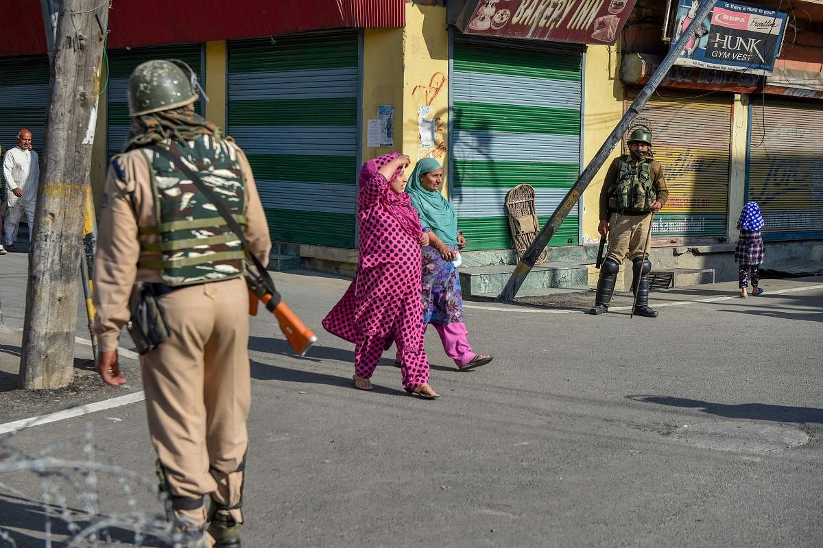 Security personnel stands guard during restrictions and strike called by separatists after the killing of PhD scholar-turned-Hizbul Mujahideen commander Manaan Bashir Wani in an encounter with security forces, in Srinagar. PTI