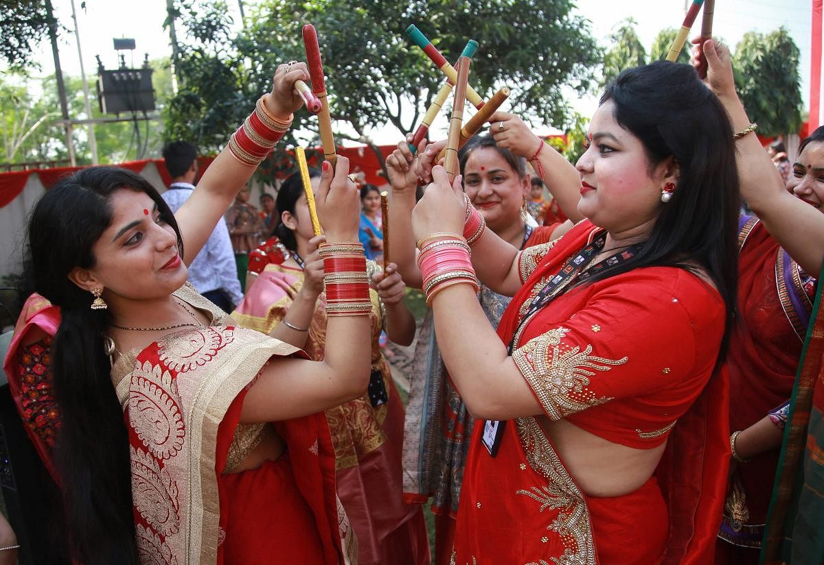 School teachers perform 'Dandiya' dance during Navratri festival celebrations in Jammu. PTI