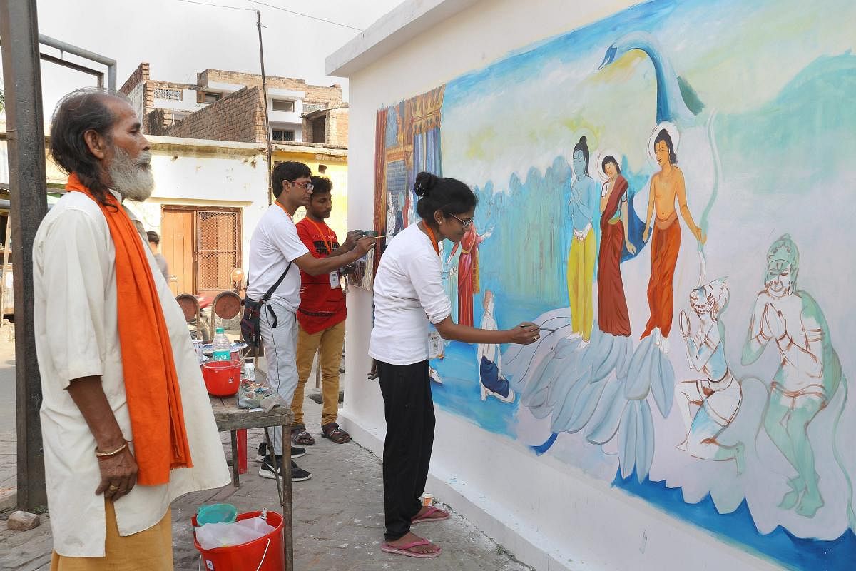 Artists make a wall graffiti on the life of Lord Rama, ahead of Ram Navami festival in Ayodhya. PTI